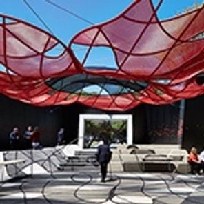 People chat in the Education Courtyard