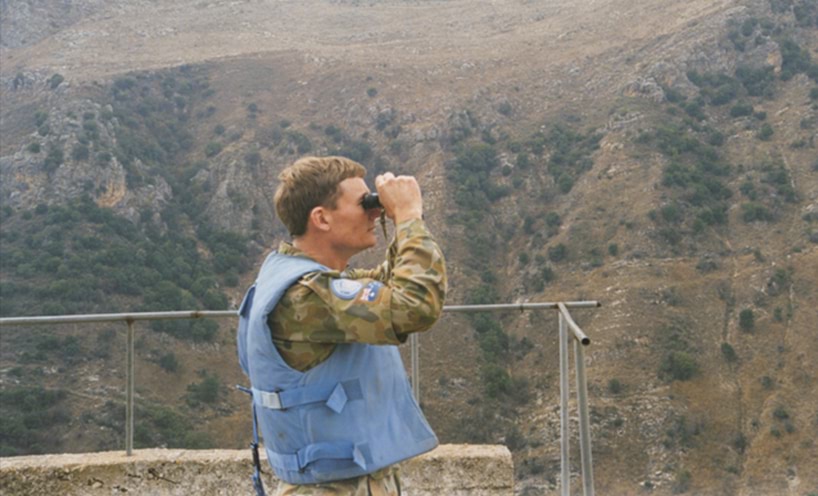 Keeping watch 20 October 1997 photographer Peter Londey Lieutenant Colonel Paul Symon identifying the target of shelling in the Israeli-occupied area of southern Lebanon. Australian War Memorial (P03530.004)