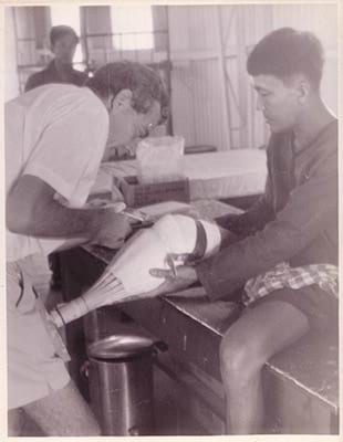 Dr Charles Shearer fits a prisoner with a new artificial leg