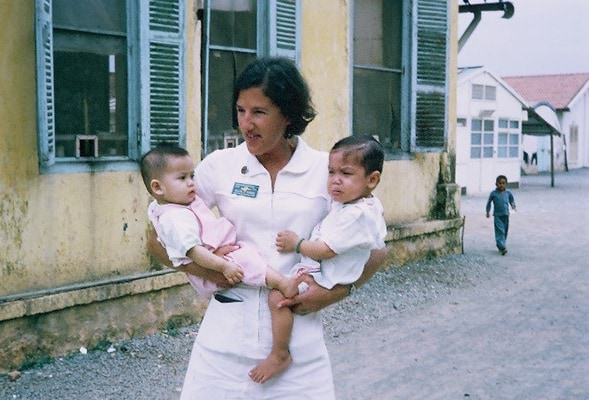 Helen Taplin with two of her young patients outside the hospital