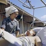 An Australian Army nurse and her patient. An Australian Army nurse and her patient.