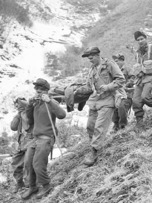 Stretcher bearers of 3rd Battalion, The Royal Australian Regiment, evacuate a wounded soldier.