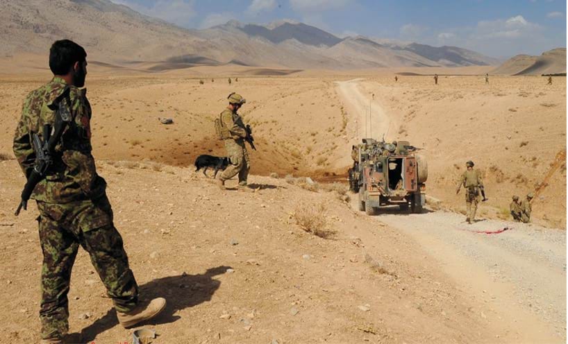 Afghan and Australian soldiers secure the incident site 23 September 2011