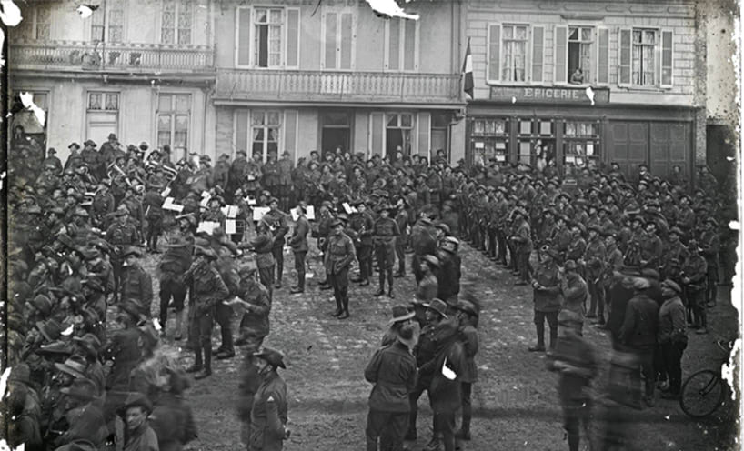 Australian soldiers eagerly watch the clock as they wait for the 11th hour to strike, signalling the end of hostilities.