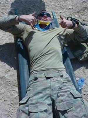 Trooper Rhys ‘Ned’ Kelly giving a thumbs up 23 September 2011