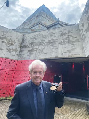 Peter Meehan holds the Shrine Medal
