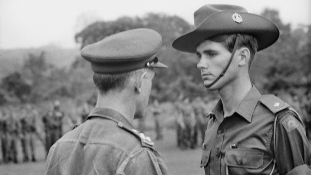 2nd Lieutenant Dave Sabben receiving his Mentioned in Despatches from Task Force Commander Brigadier Oliver Jackson.