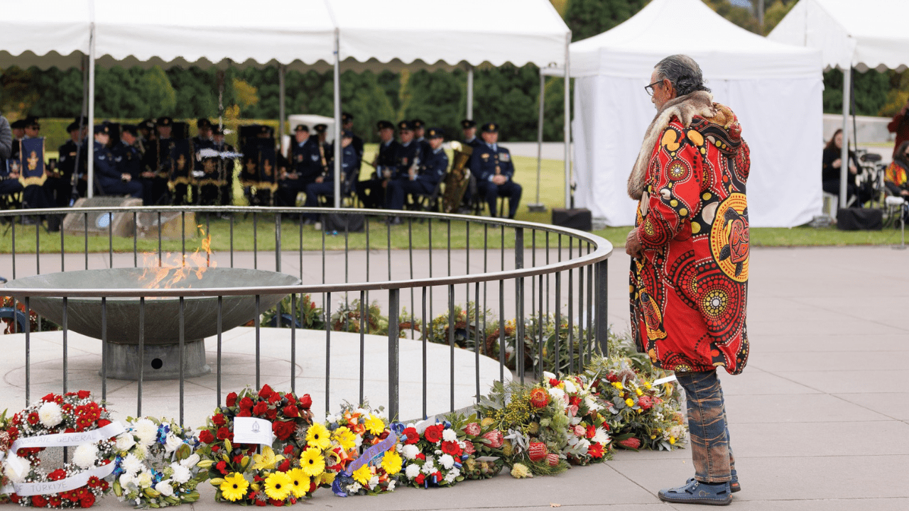 Colourful floral wreaths surround the Eternal Flame at the Victorian Aboriginal Remembrance Service in 2025.