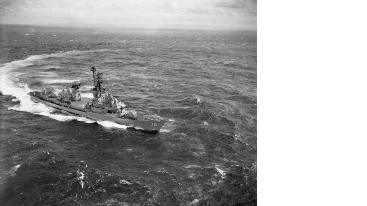 Black and white image of HMAS Hobart at sea off the coast of Vietnam, 1967
