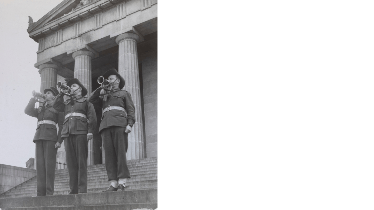 Black and white image of three buglers on the steps of the Shrine of Remembrance, sounding the Last Post to commemorate the end of the Second World War.