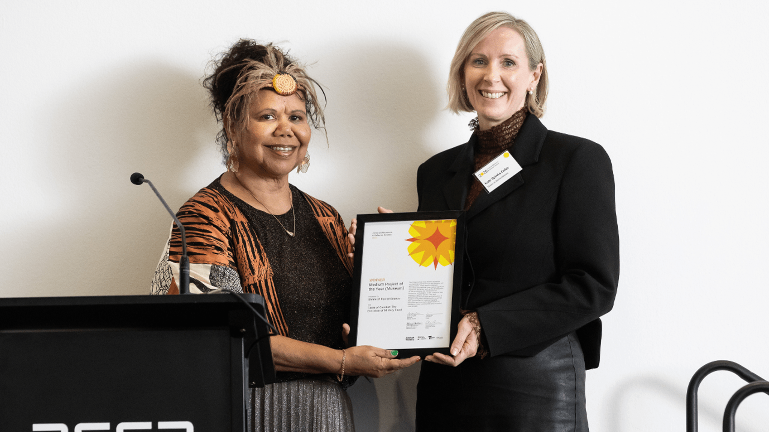 Curator Kate Spinks-Colas accepts AMAGA award for Taste of Combat