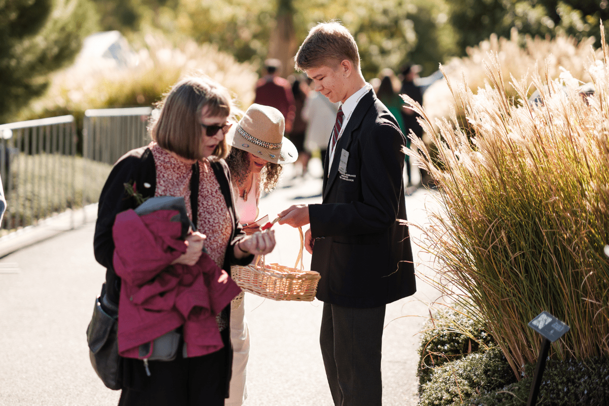 Volunteer handing out poppies